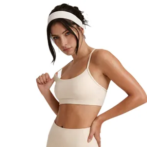 High-intensity shockproof yoga sports bra with thin straps in a minimalist beige nude color
