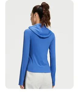 Detailed back view of a blue hooded tight sports jacket for women yoga fitness
