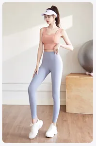 Two-piece peach sports bra and light blue high-waisted yoga leggings fitness set