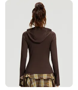 Detailed back view of a slim fit brown hooded yoga jacket made of windproof fabric