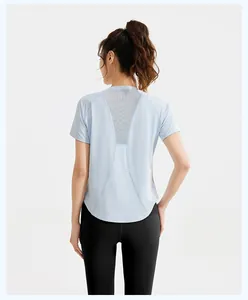 Back view of light blue mesh t-shirt with black high waist fitness leggings