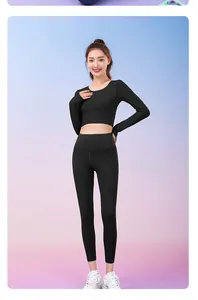 Full view of a black yoga set featuring a long-sleeve crop top and high-waist leggings.