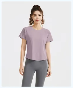 Mauve short sleeve gym T-shirt paired with high waist grey yoga leggings for fitness