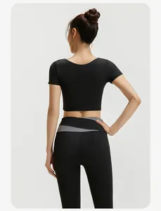 Rückansicht der schwarzen High-Waist-Yoga-Leggings mit grauem Farblock-Bunddetail