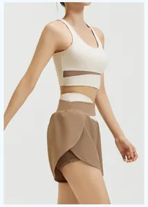 Detailed side view of cream sports bra and brown layered athletic yoga shorts set