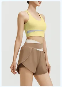 Pale yellow sports bra and coffee brown high-waisted yoga shorts set for fitness and running