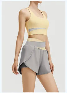 Detailed side view of a yellow sports bra and grey layered yoga shorts fitness set