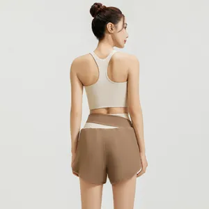 Summer yoga set featuring a racerback sports bra and high-waisted shorts in brown