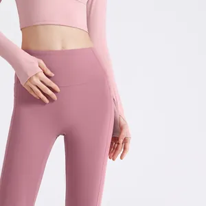 Set yoga rosa a vita alta con design senza cuciture e top a maniche lunghe slim fit.