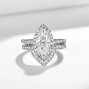 Detailed view of vintage marquise-cut 2ct ring set featuring elegant milgrain silver bands