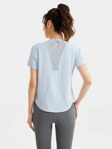 Women's light blue back mesh workout t-shirt with grey high waisted fitness leggings