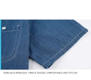 Close-up of the sleeve and stitching detail on a blue cotton denim shirt.