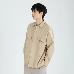 Classic men's khaki minimalist utility shirt jacket with double pockets worn by model