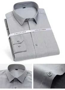 Detailed view of folded grey men's business shirt with non-iron fabric texture