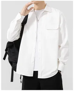 Front view of white cotton men's shirt showing chest pocket detail and soft texture.