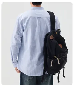 Back view detail of a men's blue and white striped long sleeve cotton Oxford shirt
