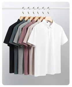 Close-up detail of hexagon pique polo shirts in various colors hanging on wooden racks