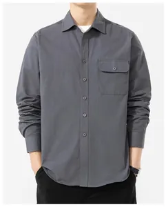 Front view of a minimalist men's grey long-sleeved cotton shirt with a chest pocket