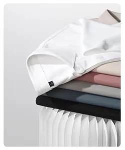 Close-up of stacked colorful polo shirts showing breathable hex mesh fabric texture