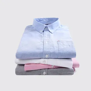 Pile de chemises Oxford en coton à manches longues pour hommes en bleu blanc rose gris