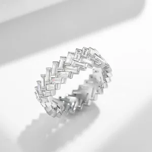 Detailed macro shot showing staggered baguette moissanite stones on a silver band