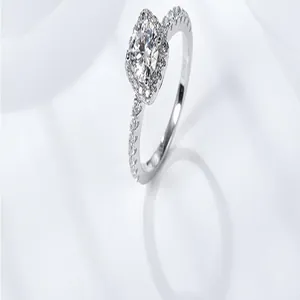 Detailed close-up view of a 3-carat moissanite halo engagement ring in sterling silver
