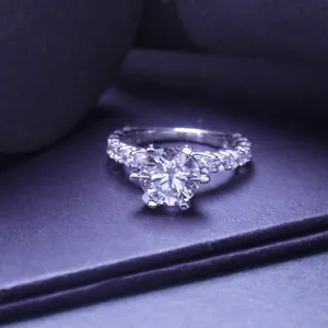 Detailed close-up of a 3-carat moissanite ring with a sparkling round-cut stone