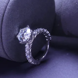 Macro detail of a 3-carat moissanite ring with a brilliant round-cut center stone