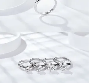 Dettaglio degli anelli in moissanite argento S925 con design a sei punte e fascia ritorta
