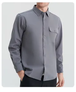 Close-up detail of a classic grey long-sleeved button-down shirt for men with pocket