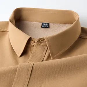 Detail of khaki men's fleece-lined cotton shirt collar with visible warm lining