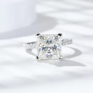 Close-up of a 5 carat princess cut moissanite ring in sparkling silver