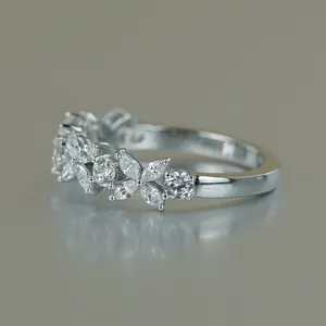 Detail of marquise moissanite ring in lucky four-leaf clover design with silver finish