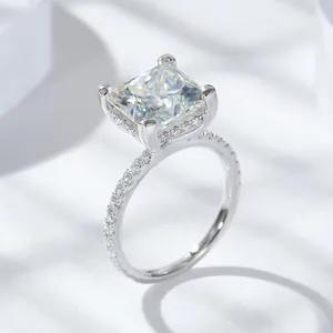 Close-up of a 5 carat princess-cut moissanite ring with elegant pavé-set band detail
