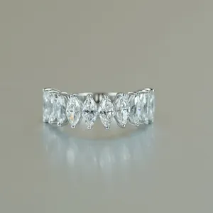 Close-up of marquise-cut moissanite stones set in a sterling silver row ring band