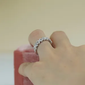 Elegant close-up of a marquise moissanite clover half eternity ring in silver finish