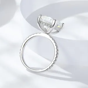 Detailed side view of 5ct princess cut moissanite silver ring with pavé setting
