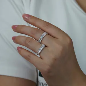 Elegant 2x4mm baguette-cut D color Moissanite eternity band ring in silver tone.