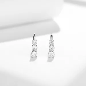 Close-up view of elegant 4.0mm three-stone moissanite drop earrings in polished S925 silver