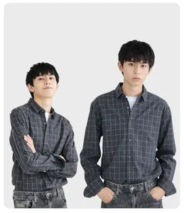 Close-up detail of men's grey plaid long-sleeved flannel shirt with a minimalist design