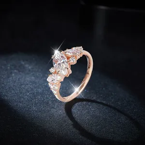 Close-up detail of marquise moissanite ring in 18k rose gold plated silver setting
