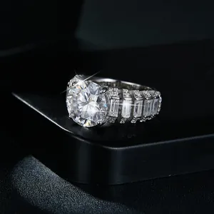 Detailed macro shot of 5ct round moissanite ring with baguette-cut side diamonds