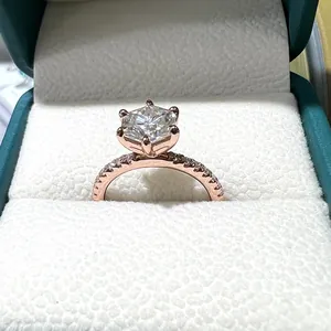 Detailed macro shot of a brilliant 7mm hexagonal moissanite engagement ring in rose gold