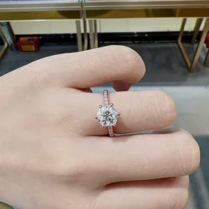 Detailed view of 7mm hexagonal moissanite ring on finger with rose gold finish