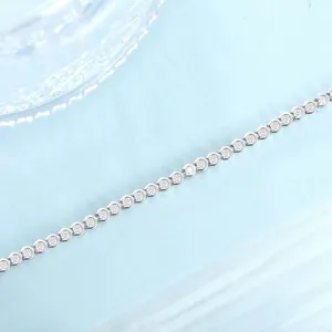 Detailed view of 1.8mm round moissanite horseshoe link silver bracelet with sparkling stones