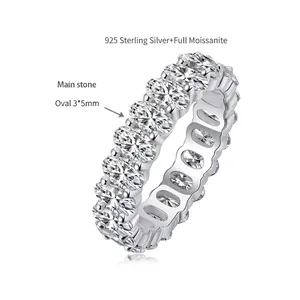 Detail of moissanite eternity ring with 3x5mm oval cut stones in 925 silver.