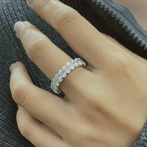 Detail shot of elegant eternity ring featuring 3x5mm oval cut moissanite stones