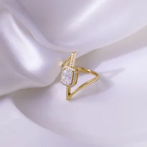 Close-up of a 2 carat radiant cut moissanite ring with gold plated silver asymmetrical band