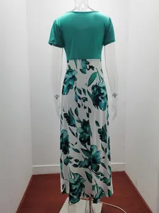 Detailed back view of turquoise and white floral print patchwork maxi dress on mannequin.