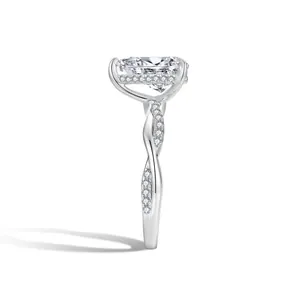 Side profile of a 2ct pear cut moissanite engagement ring with twisted pavé band
